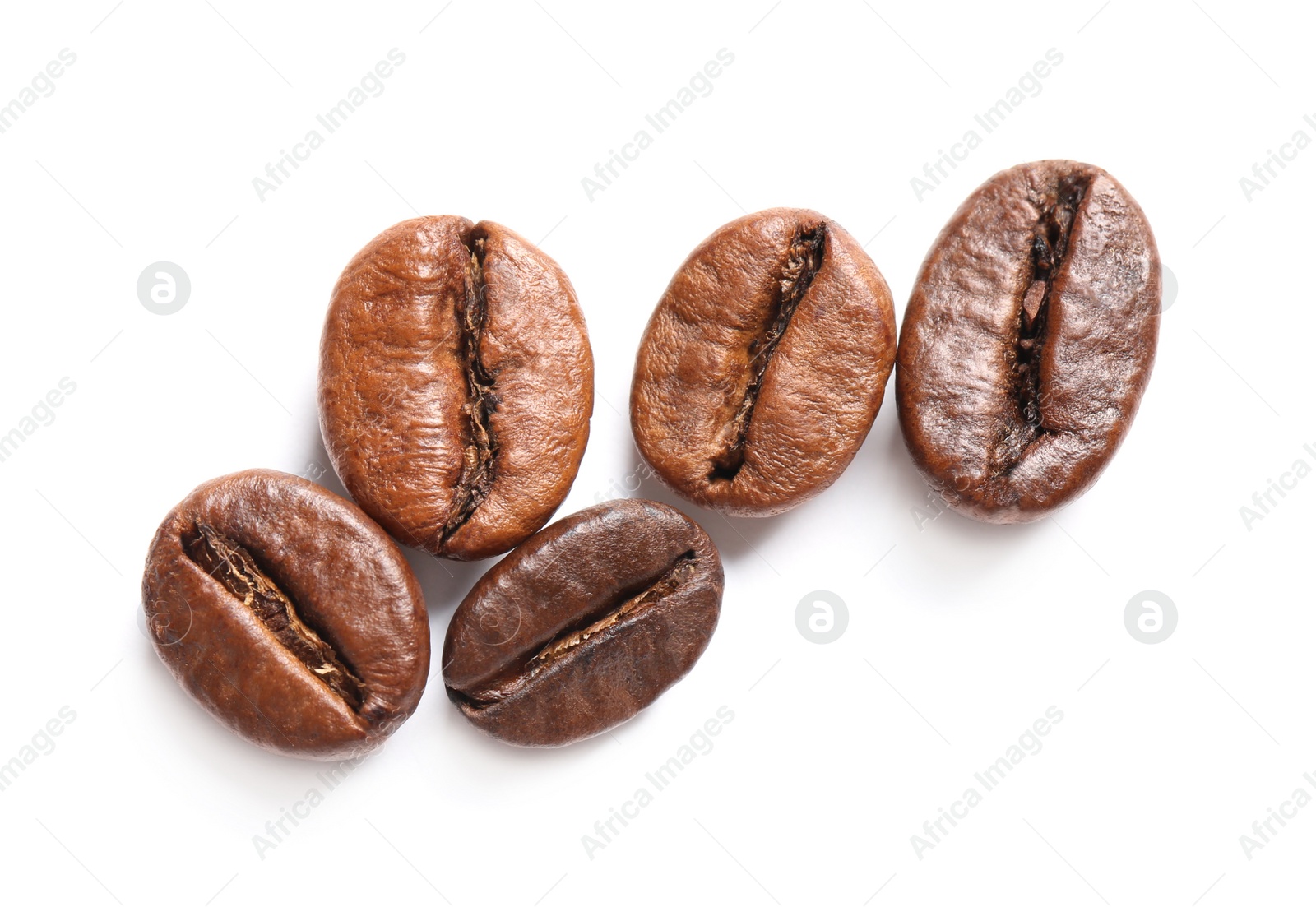 Photo of Roasted coffee beans on white background, top view