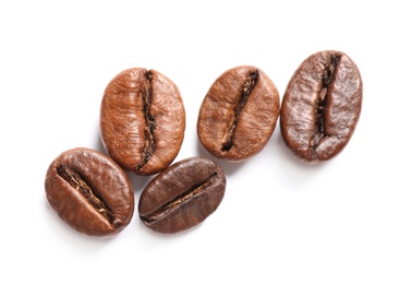 Roasted coffee beans on white background, top view