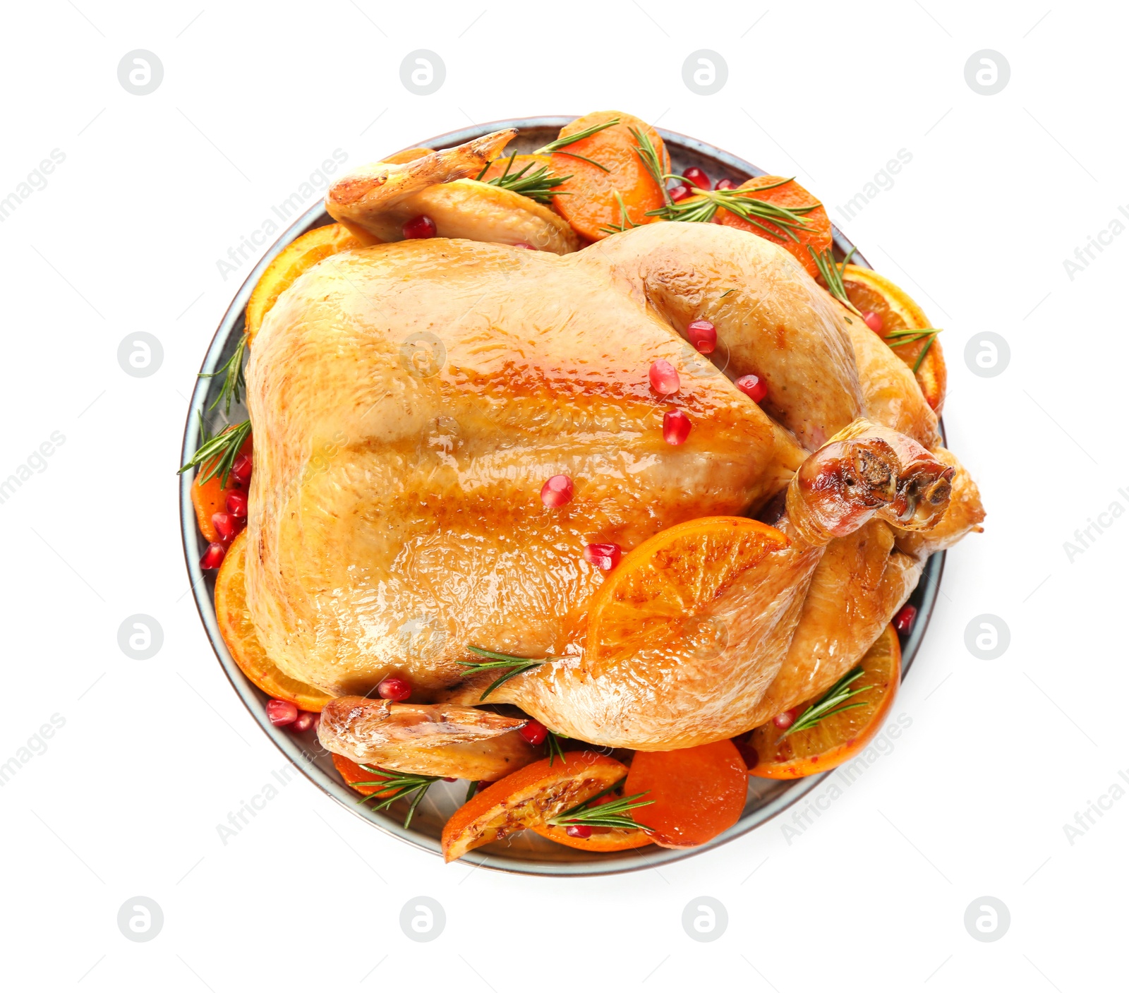 Photo of Roasted chicken with oranges, pomegranate and carrot isolated on white, top view
