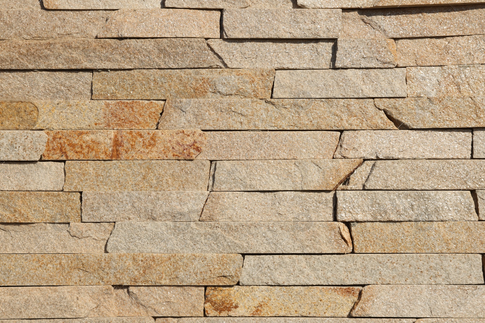 Photo of Texture of beige brick wall as background