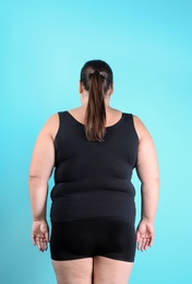 Overweight woman before weight loss on color background