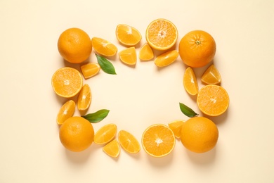 Photo of Flat lay composition with ripe oranges and space for text on color background