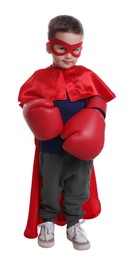 Cute little boy in superhero suit and boxing gloves on white background