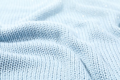 Photo of Texture of cozy warm sweater as background, closeup