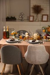 Photo of Table set with beautiful autumn decor for festive dinner in room