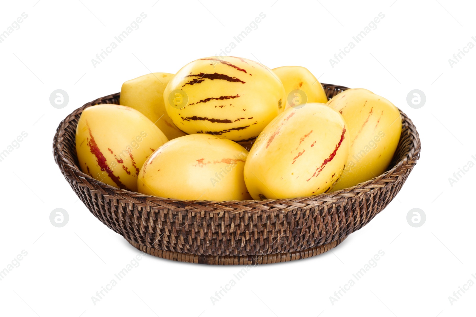 Photo of Fresh ripe pepino melons in wicker bowl on white background