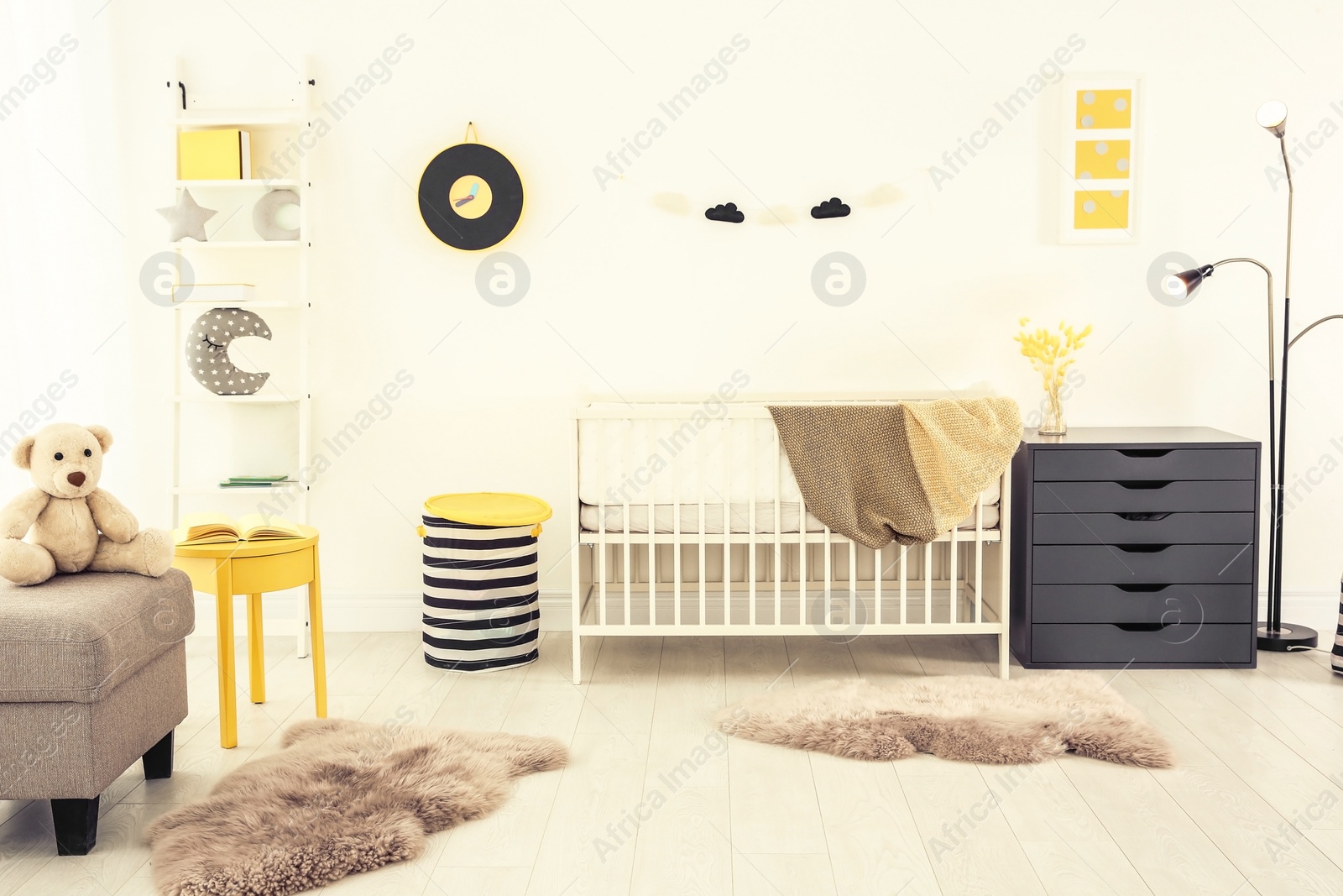 Photo of Stylish baby room interior with crib