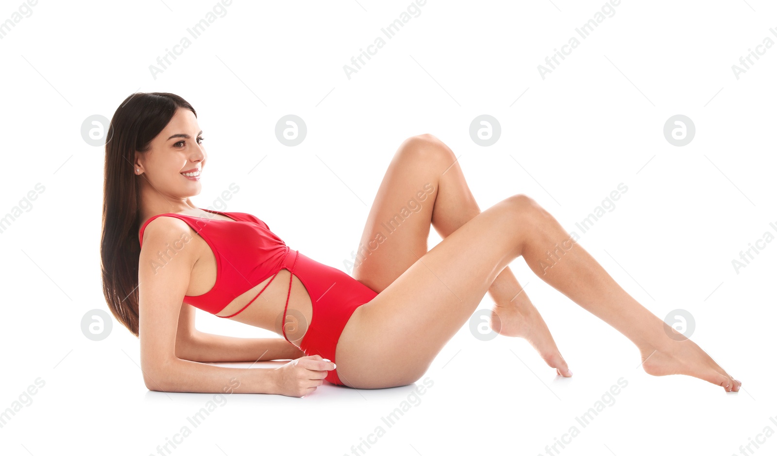 Photo of Full length portrait of attractive young woman with slim body in swimwear on white background