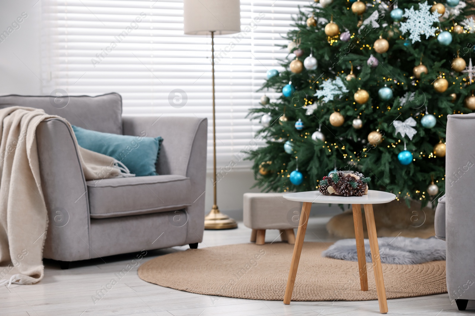 Photo of Room with Christmas tree decorated for holiday. Festive interior design