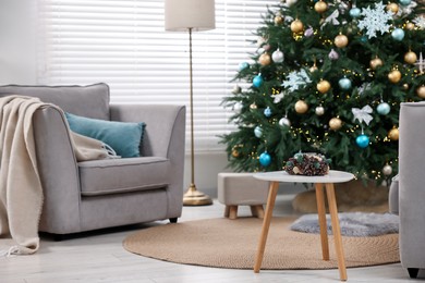 Photo of Room with Christmas tree decorated for holiday. Festive interior design
