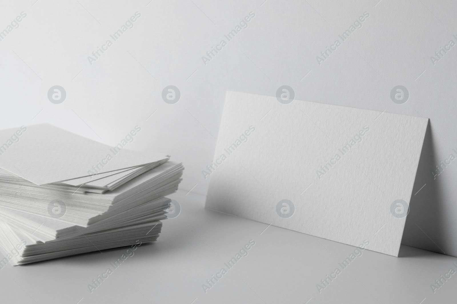 Photo of Blank business cards on white background. Mockup for design