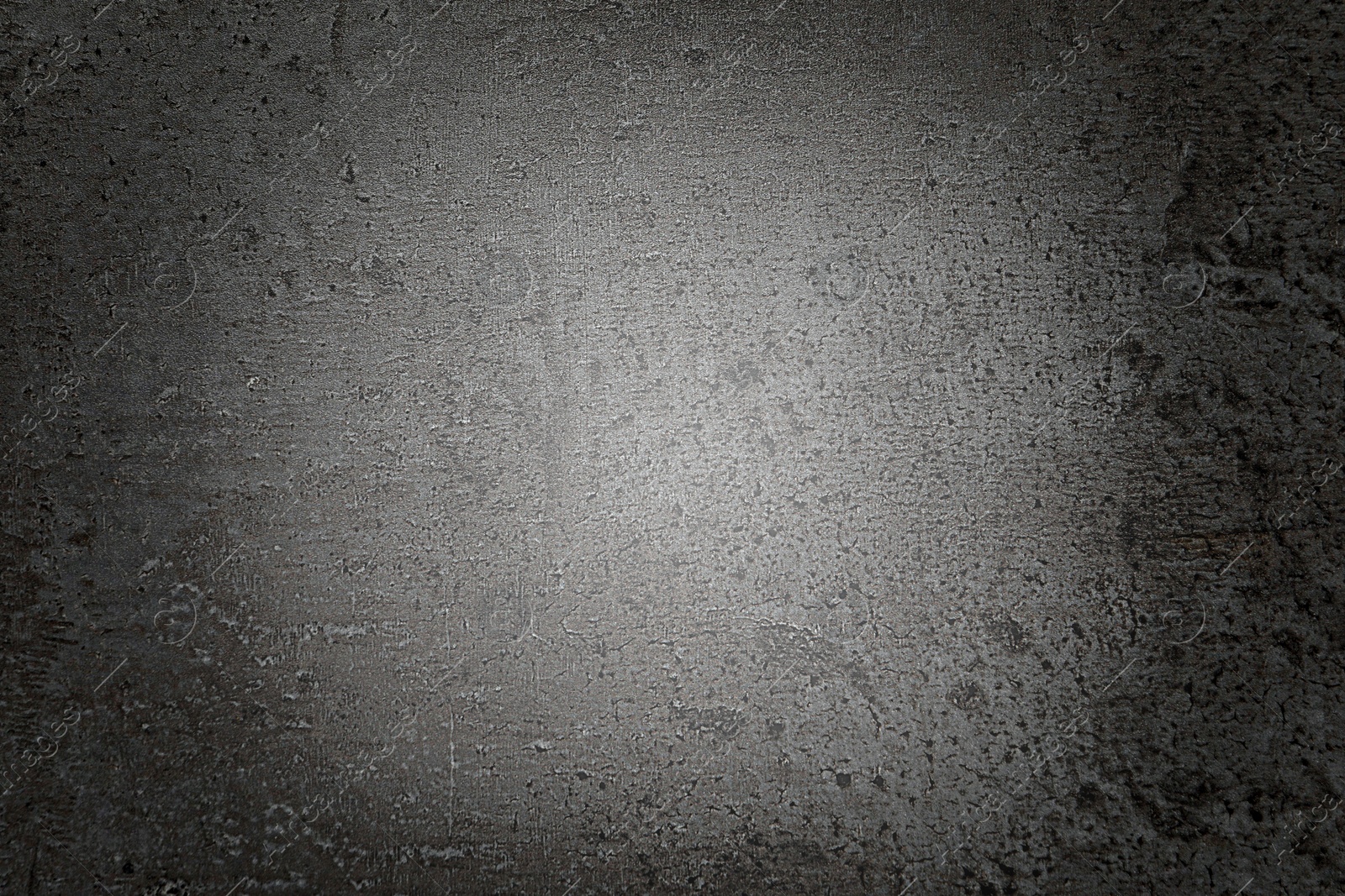 Image of Texture of dark grey stone surface spot of light as background, top view