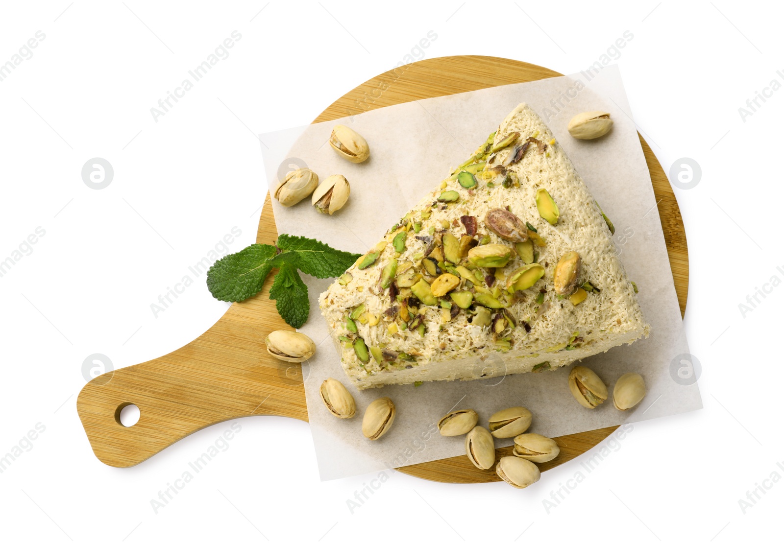 Photo of Piece of tasty halva with pistachios and mint on white background, top view