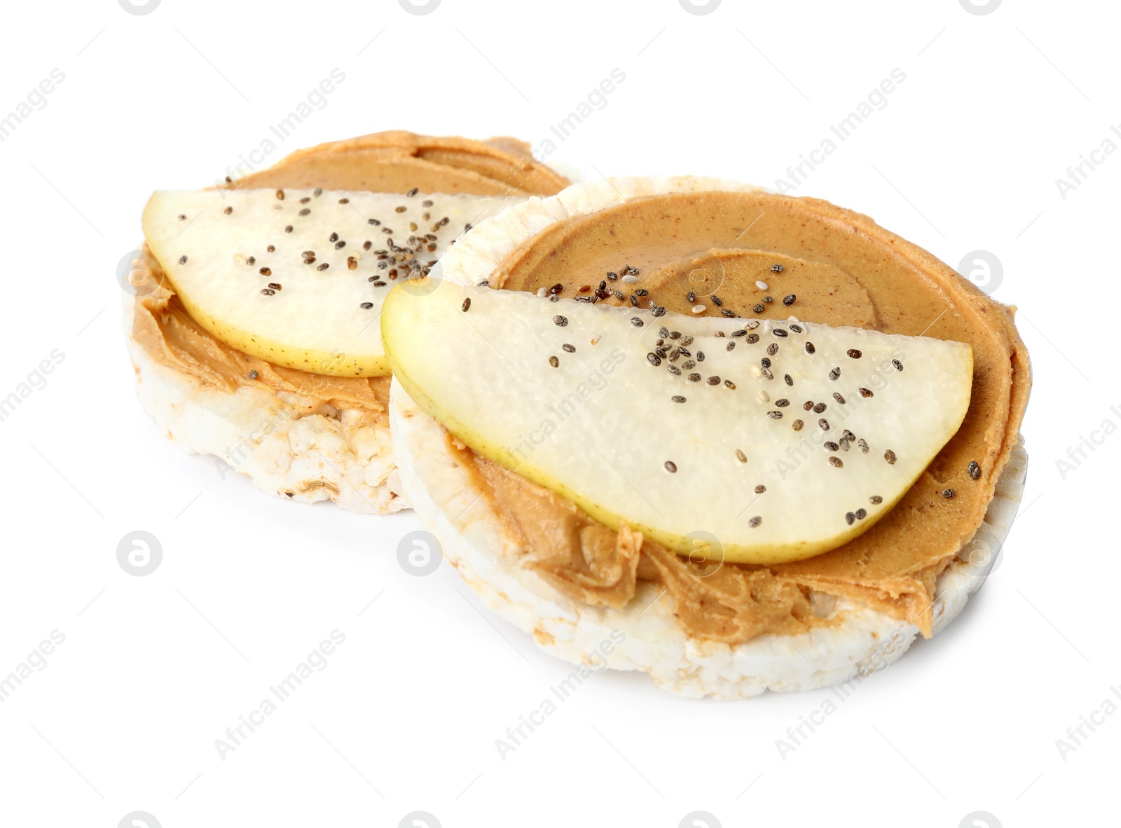 Photo of Puffed rice cakes with peanut butter and pear isolated on white