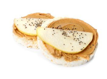 Puffed rice cakes with peanut butter and pear isolated on white