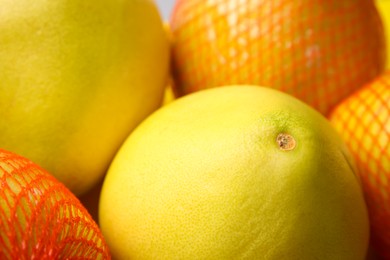 Many tasty fresh pomelo fruits, closeup view