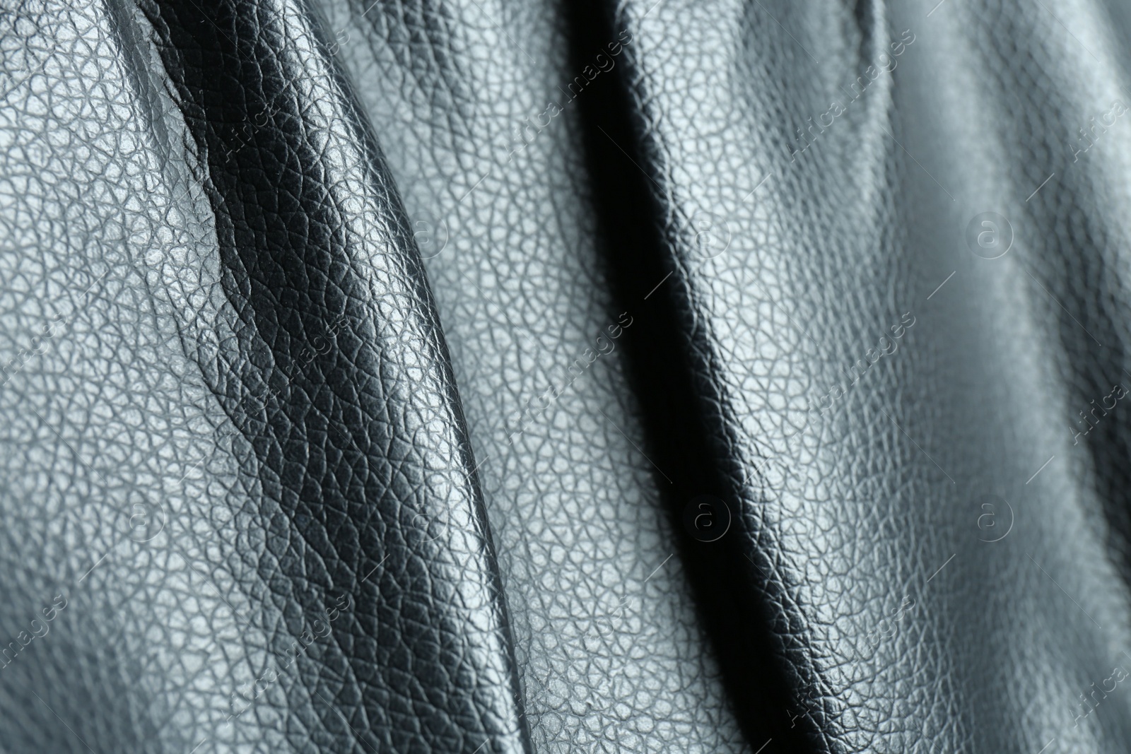 Photo of Black natural leather as background, closeup view