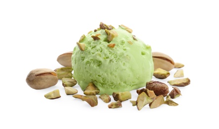 Photo of Scoop of delicious pistachio ice cream and nuts on white background