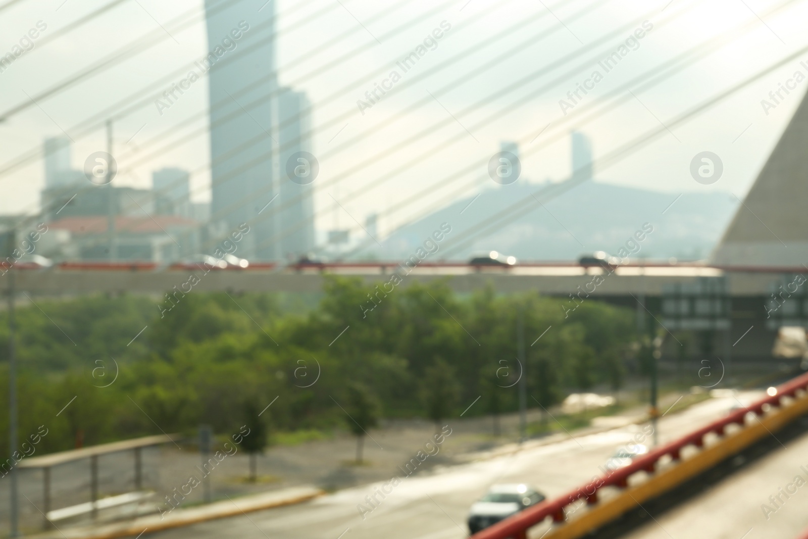 Photo of Blurred view of cars on modern bridge