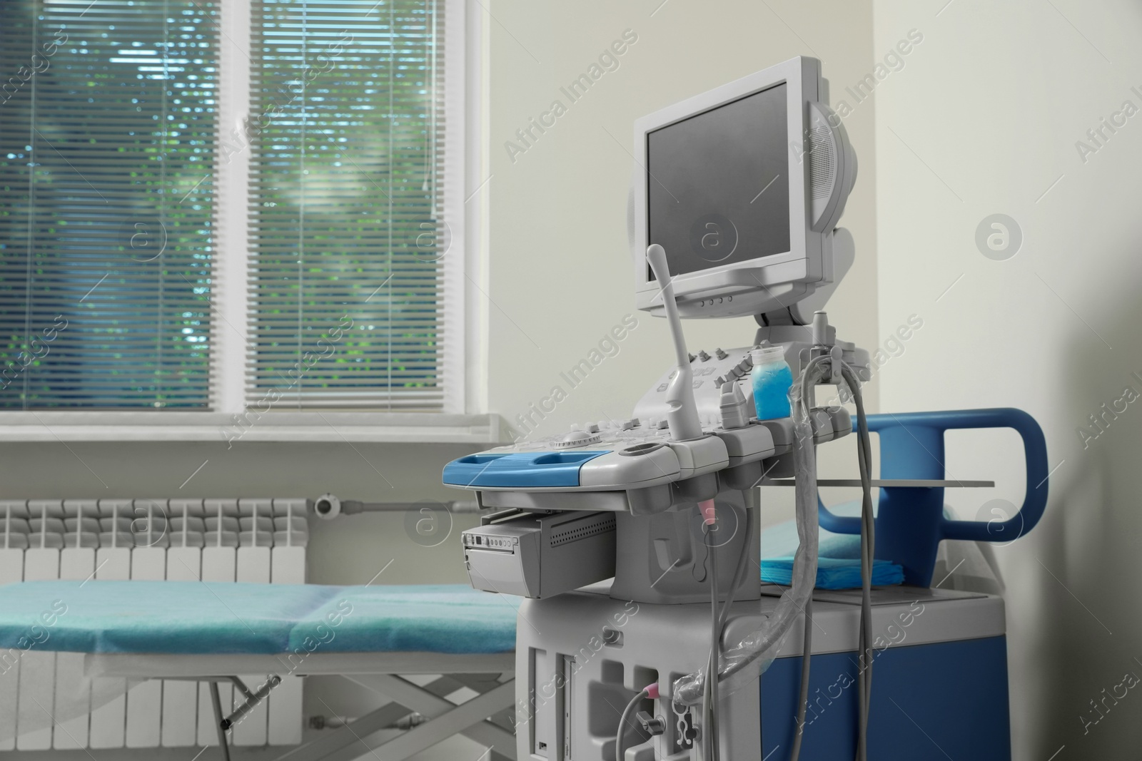 Photo of Ultrasound machine and examination table in hospital