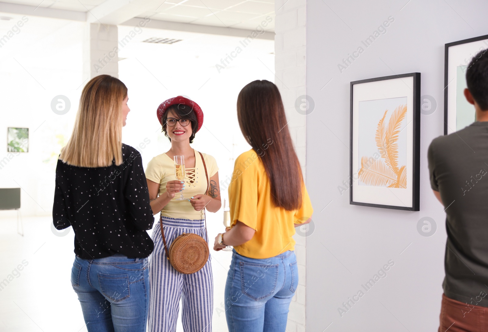 Photo of Beautiful women at exhibition in art gallery