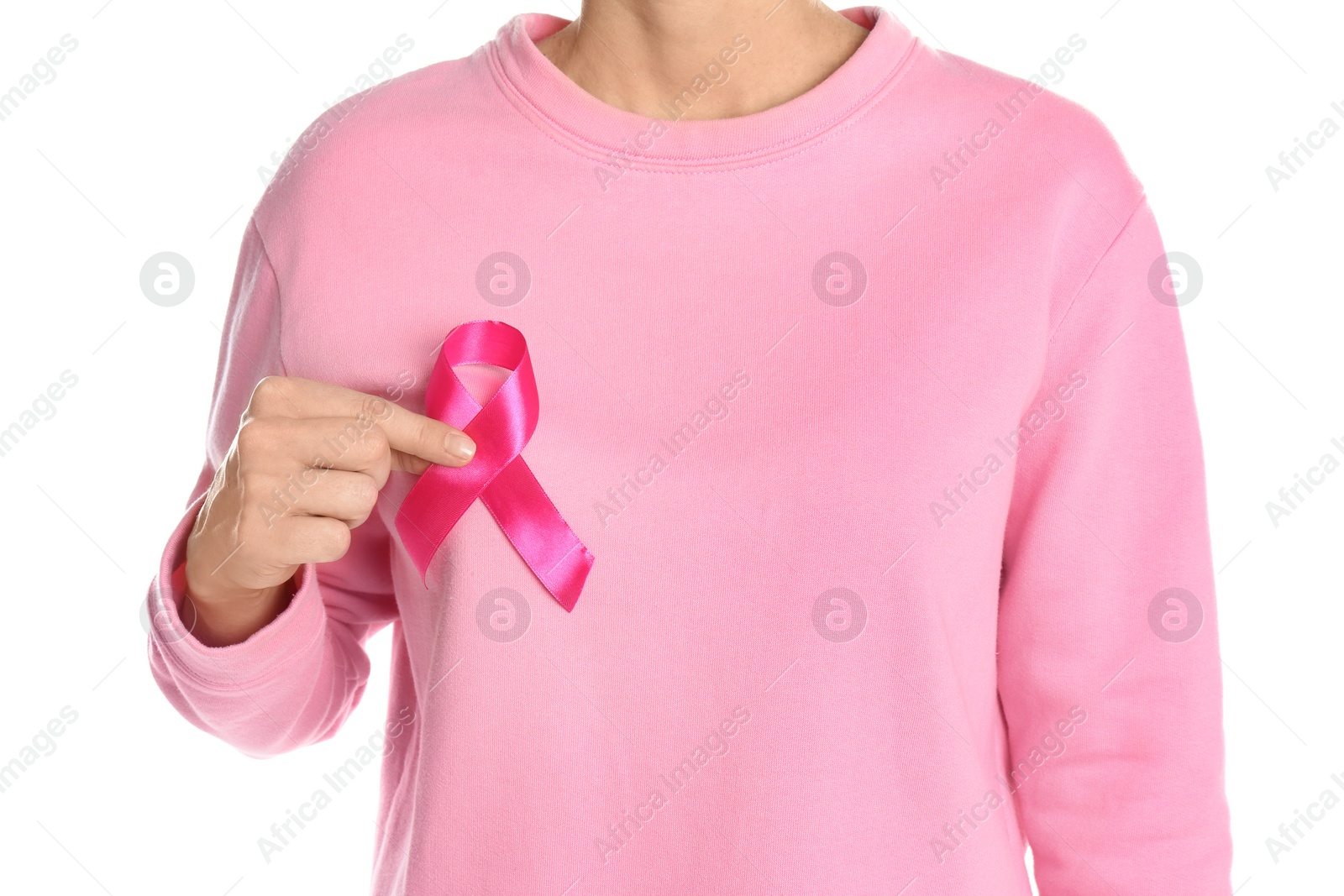 Photo of Woman holding pink ribbon on white background, closeup. Breast cancer awareness