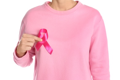 Woman holding pink ribbon on white background, closeup. Breast cancer awareness