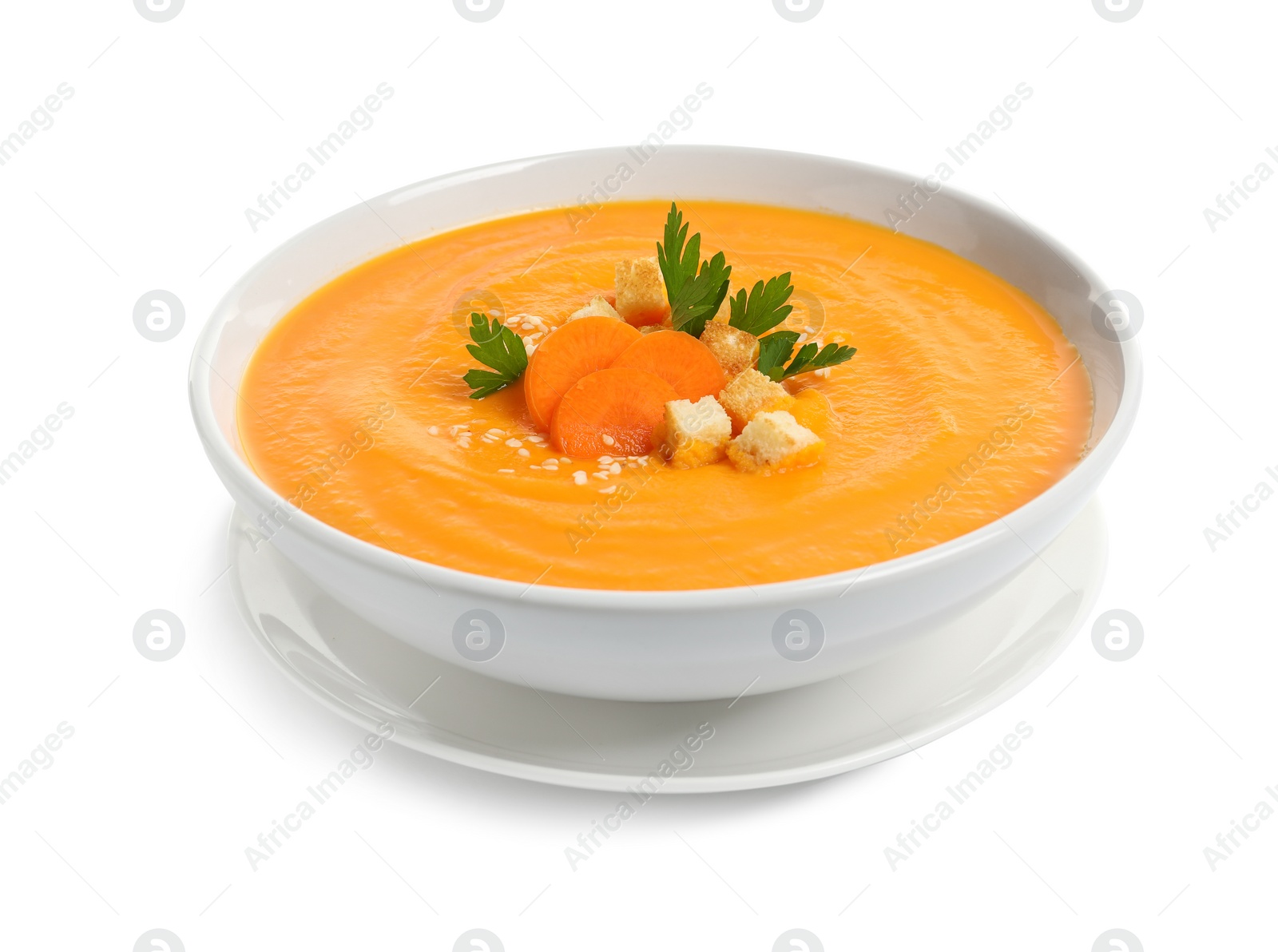 Photo of Dish with carrot cream soup on white background. Healthy food