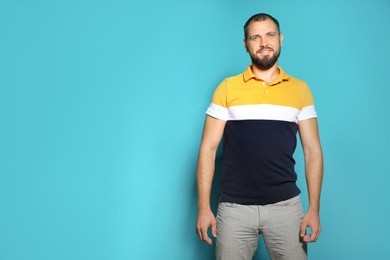 Portrait of man in casual clothes on color background