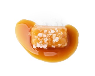 Yummy caramel candy and sea salt isolated on white, top view