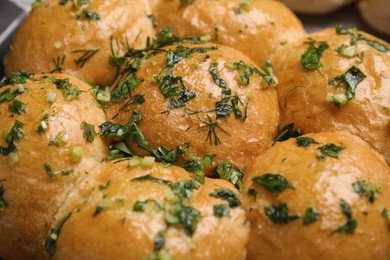 Photo of Traditional pampushka buns with garlic and herbs, closeup