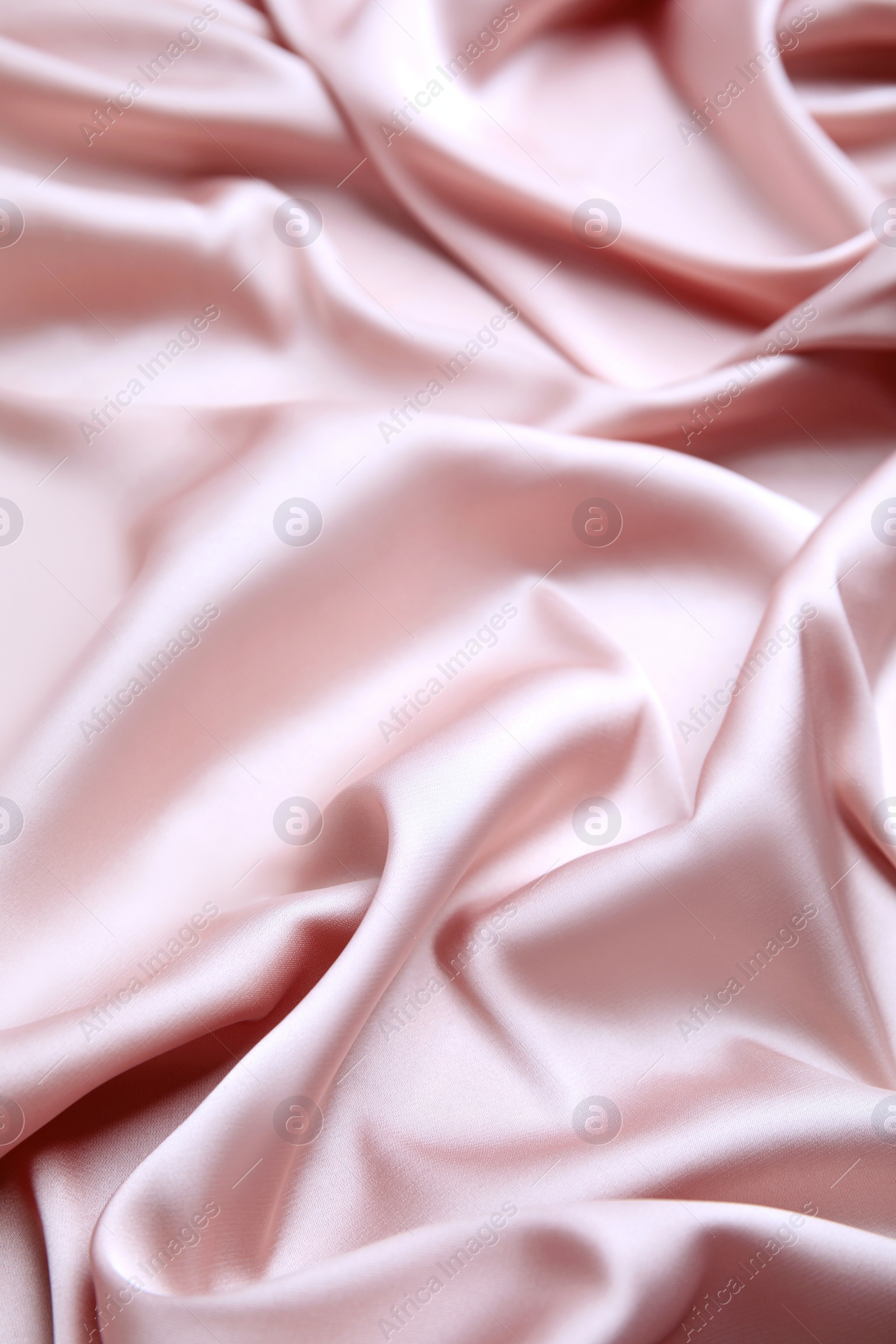 Image of Delicate pink silk fabric as background, closeup view