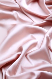 Image of Delicate pink silk fabric as background, closeup view