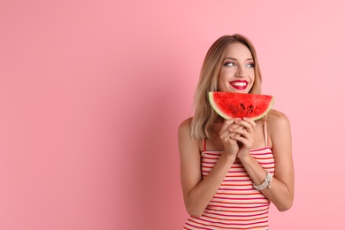 Pretty young woman with juicy watermelon on color background