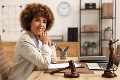 Photo of Beautiful female notary at workplace in office