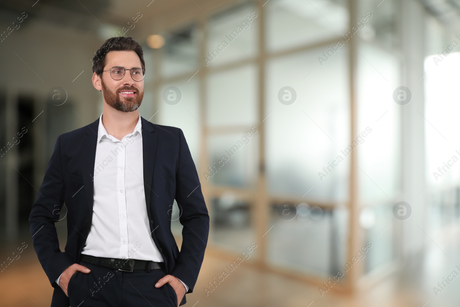 Image of Handsome confident man with eyeglasses in office, space for text