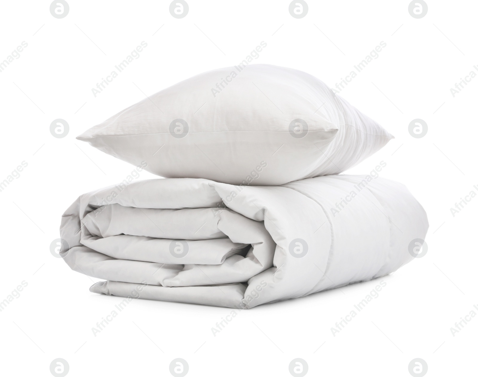 Photo of Soft blanket with pillow on white background