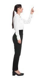 Photo of Happy businesswoman pointing at something on white background