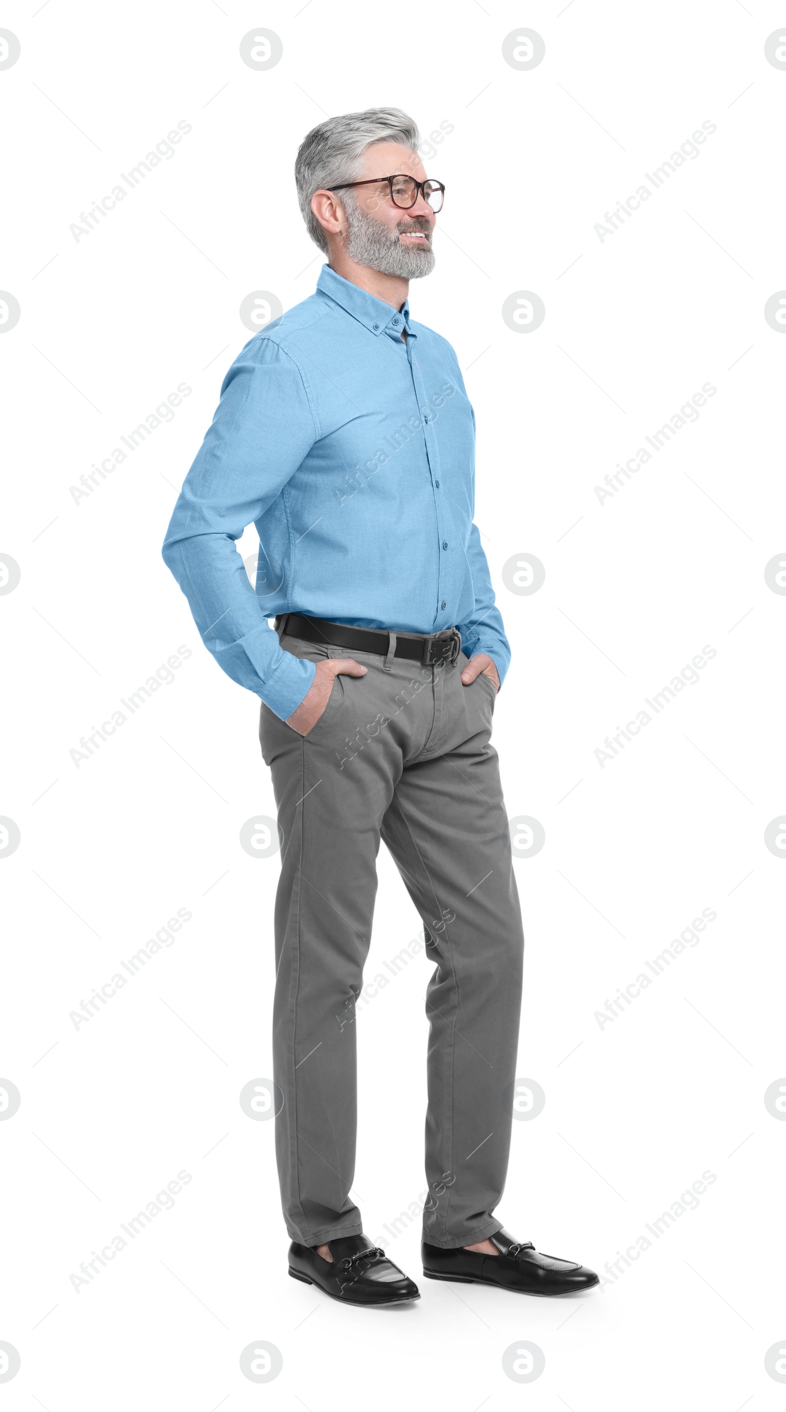 Photo of Mature businessman in stylish clothes posing on white background