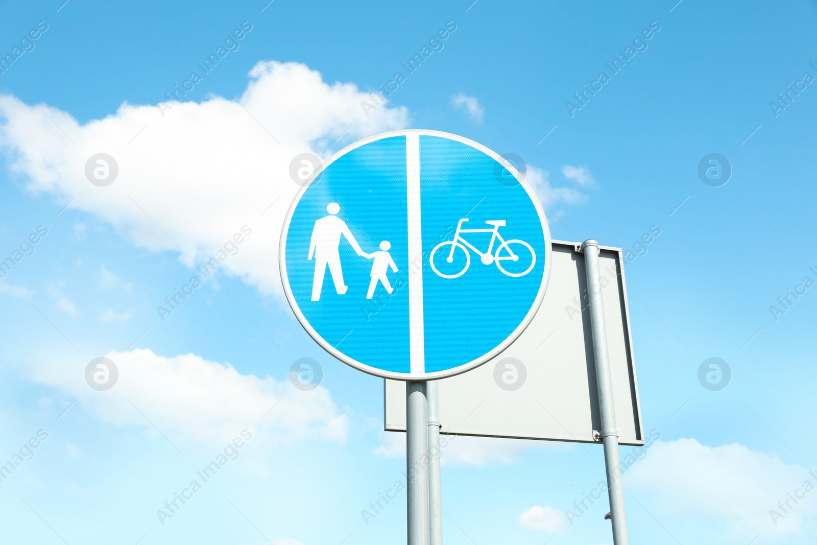 Photo of Traffic sign Compulsory Track For Pedestrians and Bicycles on city street