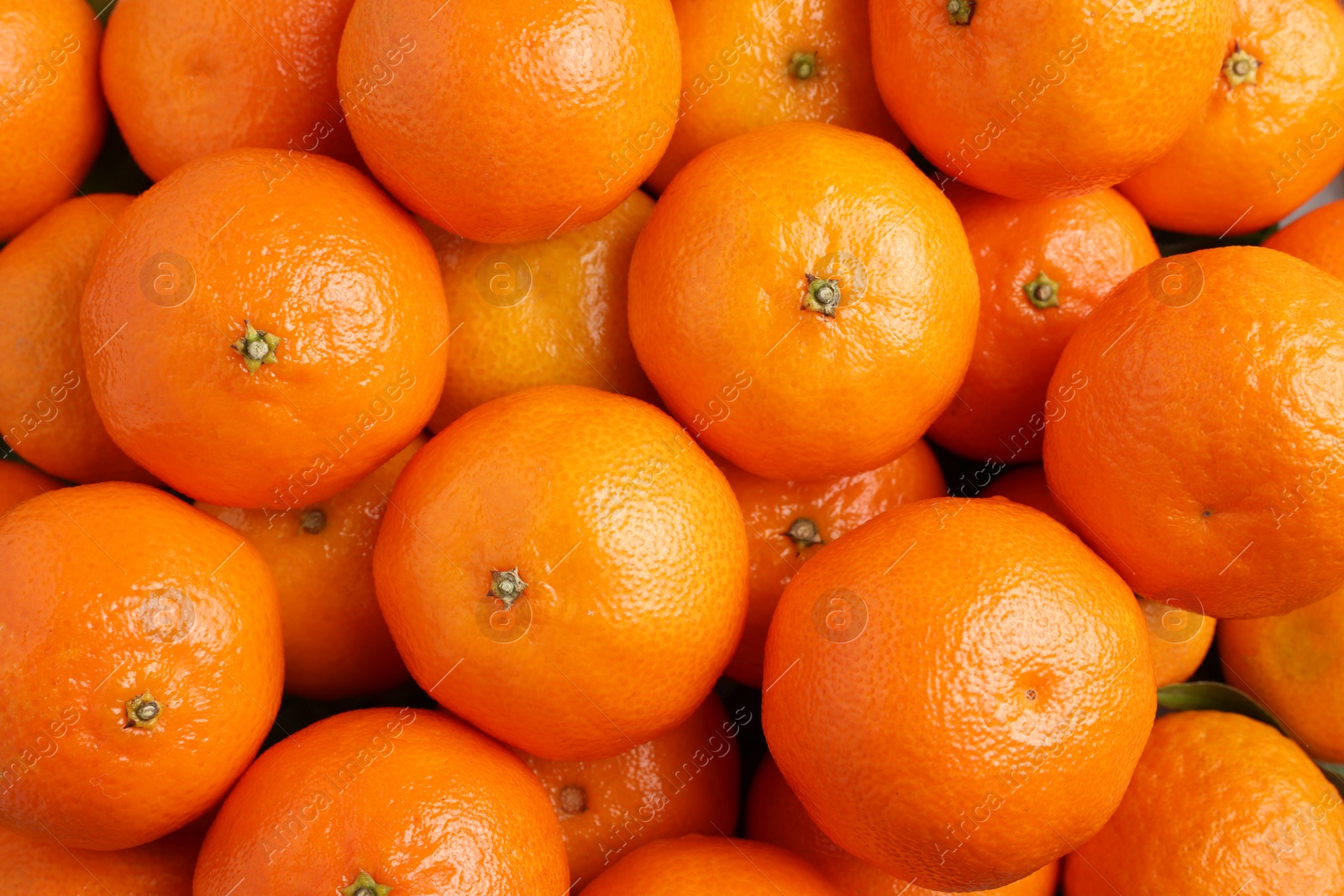 Photo of Delicious fresh tangerines as background, top view