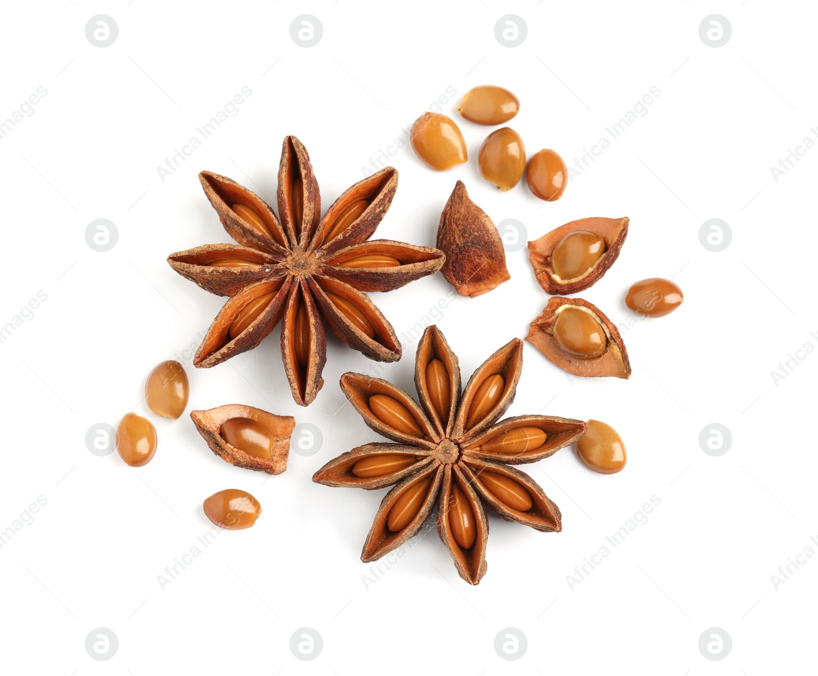 Photo of Dry anise stars with seeds on white background, top view