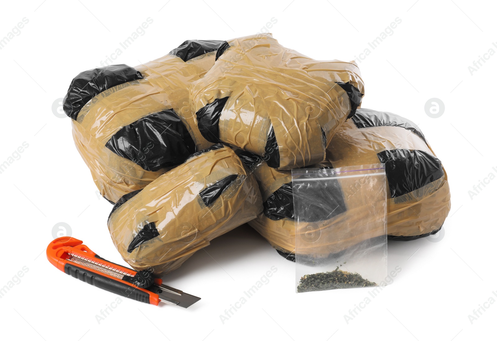 Photo of Packages with narcotics and stationery knife isolated on white