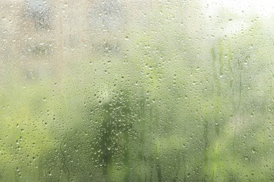 Window glass with raindrops as background, closeup