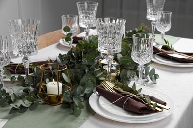 Stylish elegant table setting for festive dinner indoors