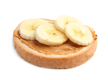 Slice of bread with peanut butter and banana on white background