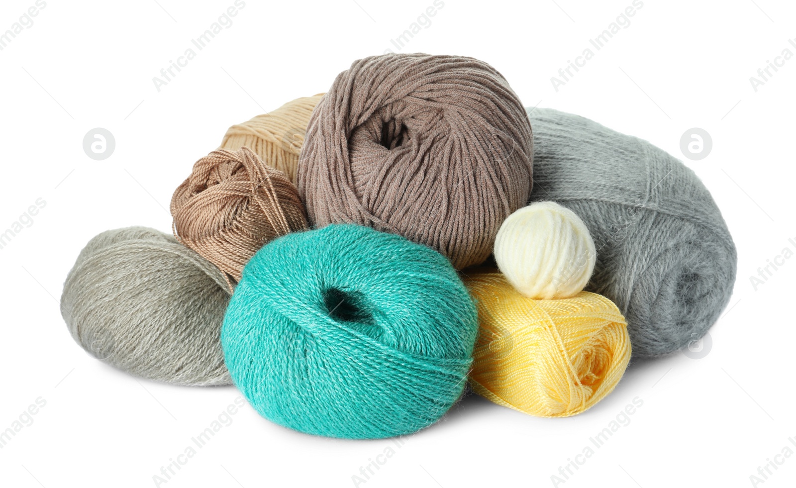 Photo of Different balls of woolen knitting yarns on white background