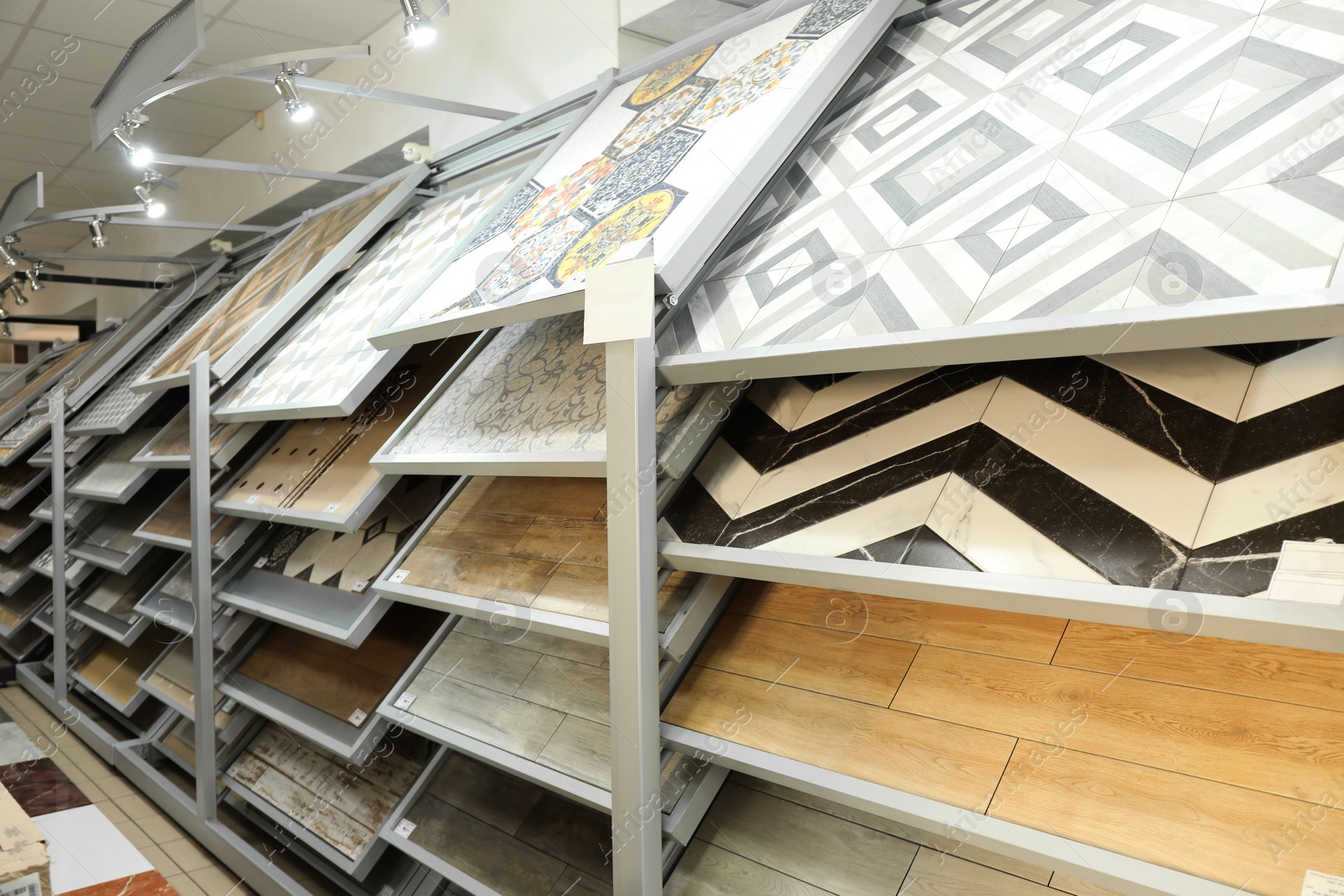 Photo of Assortment of tiles in store. Many different samples indoors