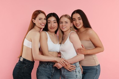 Photo of Portrait of beautiful young women on pink background