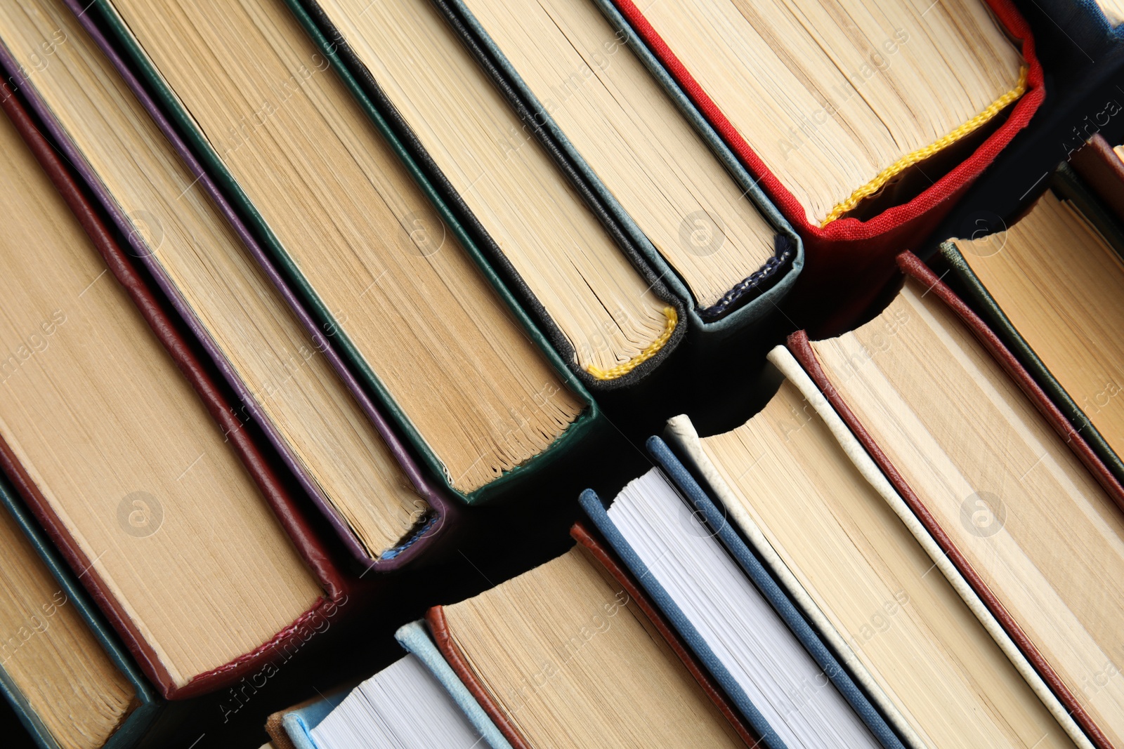 Photo of Many different hardcover books as background, top view